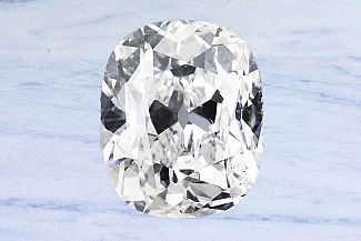 3.33 Antique Cushion Old Mine Diamond - GIA J/SI1+ 